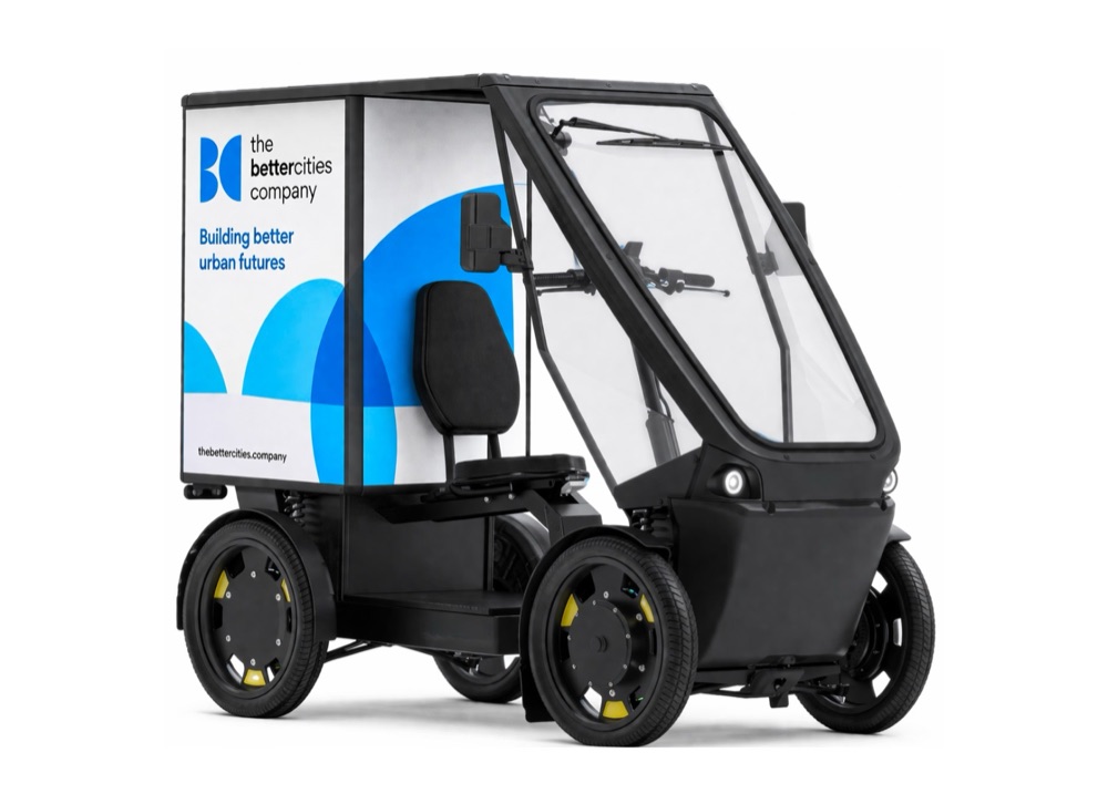 Better Cities Company four-wheel electric cargo quad with enclosed cabin and branded box